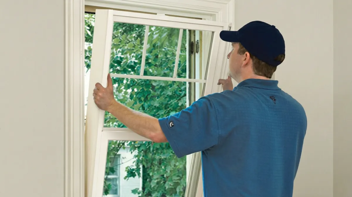 Professional contractors performing a residential window insulation and replacement service in Boise, ID